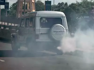 Polluting motor vehicle. Fumes spewing from exhaust