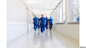 Hospital staff walking in corridor