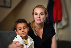 Aimee James and her son Isaac are waiting for school transport to be arranged