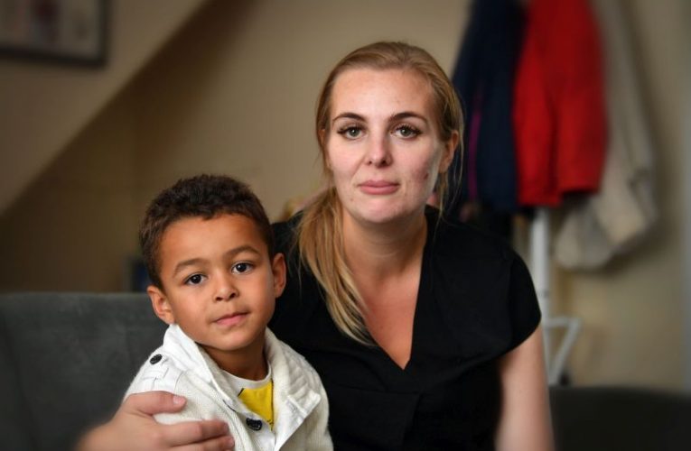 Aimee James and her son Isaac are waiting for school transport to be arranged