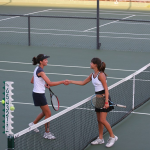 Players shaking hands after tennis match
