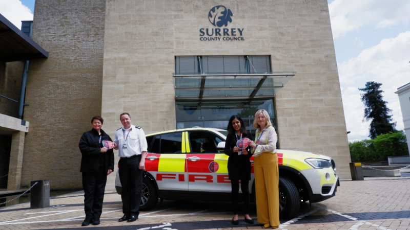 Surrey fire officers with BINTI charity
