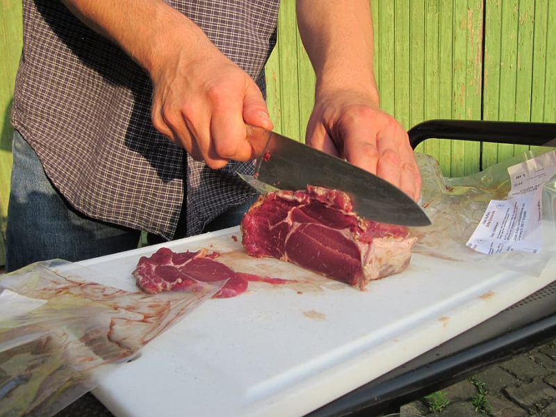 Man cutting meat