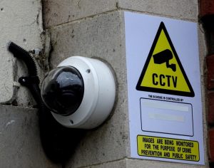 cctv and warning sign