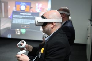 A guest trying some of the VR (Virtual Reality) kit in the VR room at the IoT.