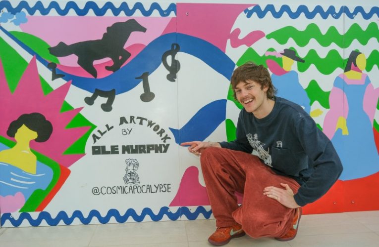 Ole Murphy next to his Epsom artwork.