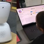 Robot in the classroom. Pupil at home connected.