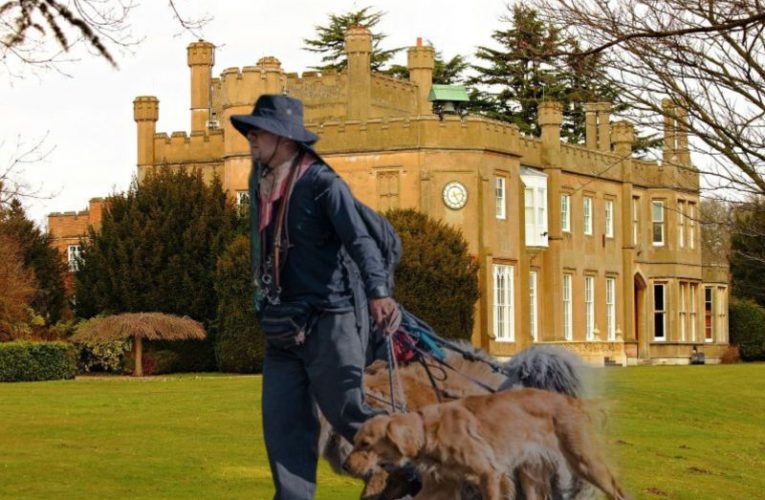 Nonsuch Mansion house and multiple dog walker