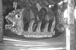 Philip Bradley seated in an Orton & Spooner 'Whale Car' at Butlins Ltd, Florence Park, Oxford, 28 Aug 1943 (Philip Bradley Collection, Surrey History Centre reference 6790/4/8).