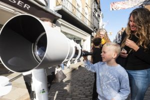 Child with space telescope