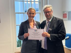 The Mayor of Epsom and Ewell, Cllr Robert Leach, presenting the Cyril Frazer Award to Olivia Gioffredo from Epsom College.