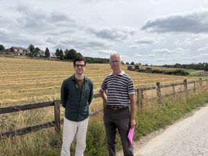Campaigners, Matt Dunn (left) and John Mumford (right), in front of the proposed development site. (Credit: Emily Dalton/LDRS)