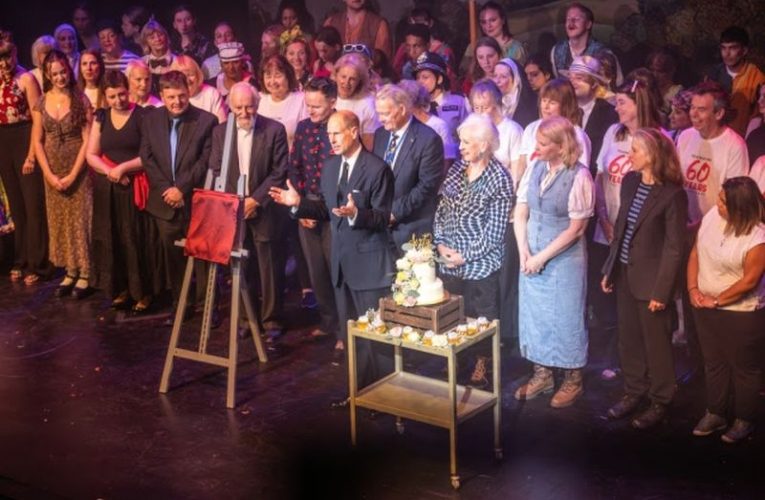 The Duke of Edinburgh addresses the audience, in front of the assembled concert company, before unveiling a commemorative plaque