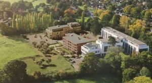 Illustrative view looking south of application site (left) and former Claygate House with Shanly Homes Oaklands Park development to the rear (Credit: Elmbridge Borough