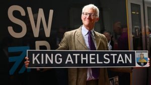 Tom Holland holds up King Athelstan train sign