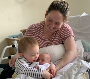 George with mum Jodie and sister Alice