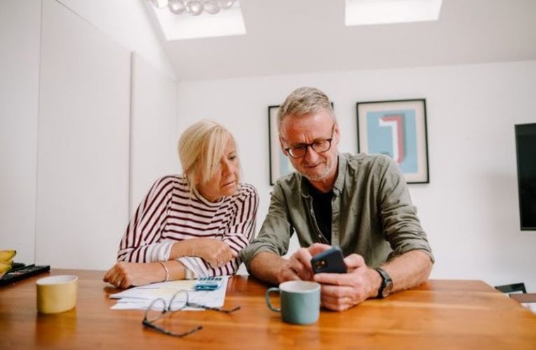 A couple calculating cost of care.