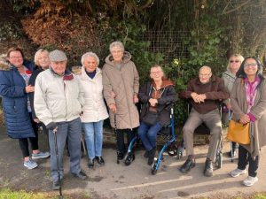 Cllr Neha Boghani right), Green councillor for Horley East, with residents of the Gardens Estate, south Horley, at the ‘ghost bus stop’ where they used to get on the 424 Metrobus (image Cllr Boghani)