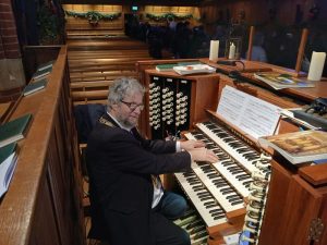 Robert Leach plays the organ