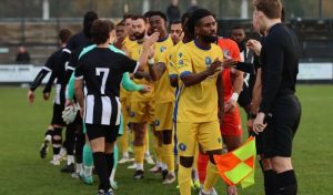 Epsom and Ewell football team greet officials