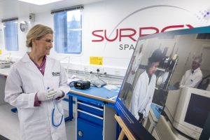 HRH The Duchess of Edinburgh looking at a picture of Her Late Majesty Queen Elizabeth II at the University of Surrey. Credit Surrey University
