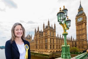 Maguire with Westminster Palace in background