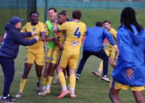 Epsom and Ewell FC players celebrate victory against Guildford City