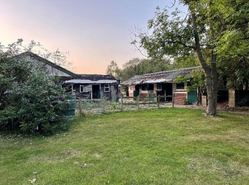 Stables and outbuildings at Clouds Hill Farm, Oxshott. (Credit: Fairmile Group Ltd./Elmbridge Borough Council planning documents). Permission to use.