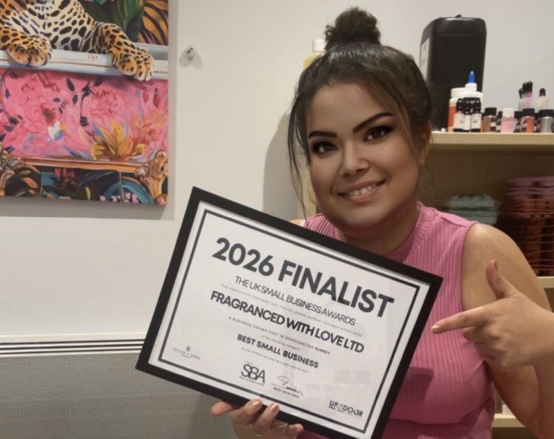 Faragalla with award certificate