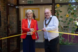 Christine and Tim Hall Cutting Ribbon