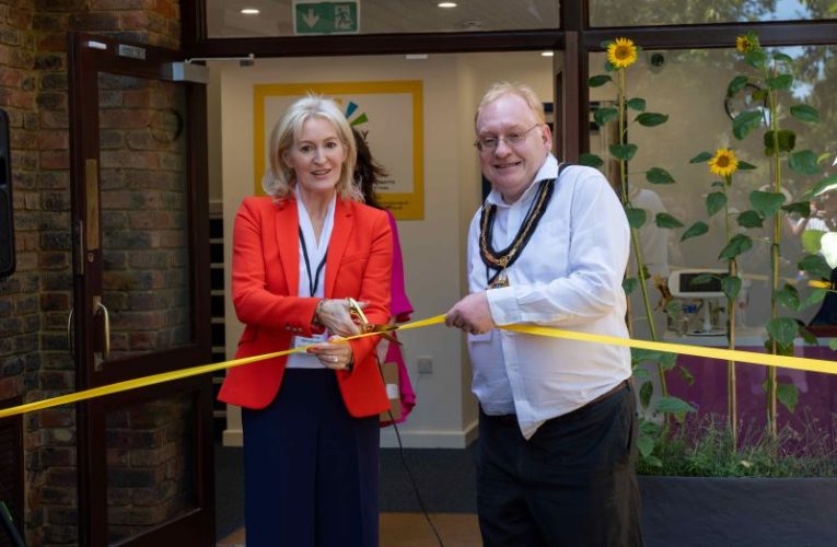 Christine and Tim Hall Cutting Ribbon