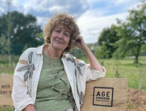 Dorah May Hancock sitting n Age Concern bench